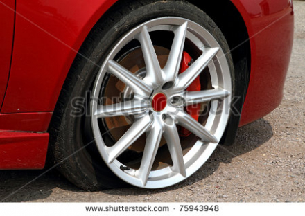 stock-photo-deflated-tyre-damage-to-car-wheel-75943948.jpg