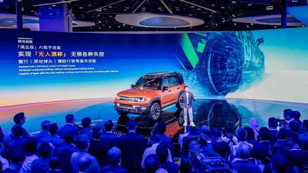 CEO of Geely Auto delivering a keynote speech.jpg