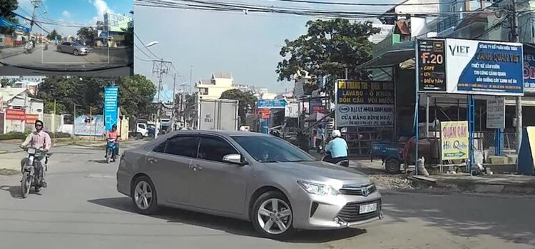 Vừa ôm con vừa lái xe