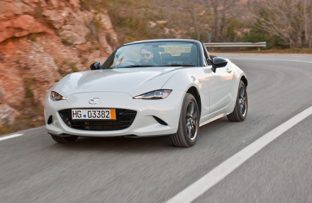 2016-Mazda-MX-5-Miata-right-hand-drive-front-view-in-white-on-road.jpg