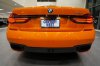 BMW 750i sơn màu “cam lửa” có giá 135.000 USD
